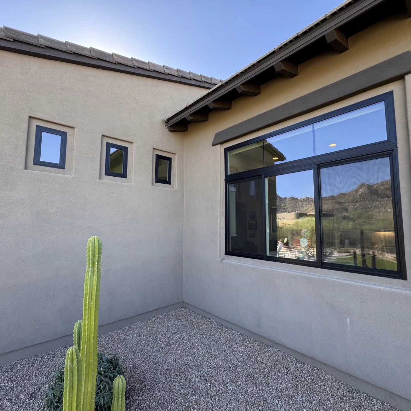 Clean windows reflecting desert landscape