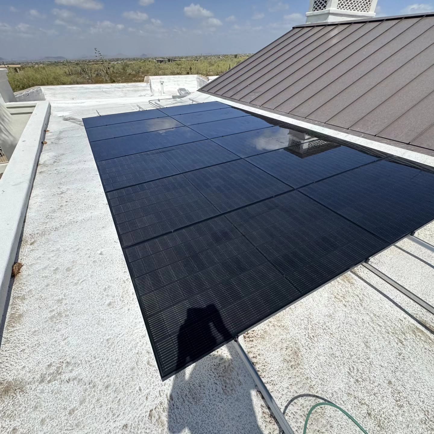 Freshly cleaned rooftop solar panel array